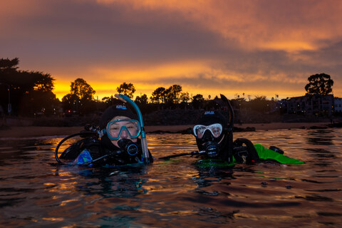 Divers at sunset